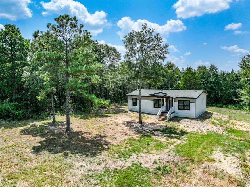 Unlock the potential of this approved, pre-platted subdivision in the tranquil countryside of Gilmer, Texas. This rare offering includes five separate lots totaling 8.902 acres, with lot sizes ranging from 1.15 to 2.5 acres — ideal for investors, builders, or anyone looking to create a homestead with room to grow.

One of the five lots already features a stunning 2023 Palm Harbor home — a turnkey-ready modern farmhouse that boasts 3 bedrooms, 2 bathrooms, 1,440 square feet of open-concept living space, and standout details like a large kitchen island, exposed beams, stainless steel farm sink, walk-in pantry and closets, and a 72” spa-style shower with body sprayers. Enjoy a private setting, a front covered entry, and a spacious back deck perfect for entertaining.

Water and electricity are already run and available across the property, making it even easier to build or expand without delay.

The remaining four lots offer endless potential for custom builds, additional manufactured homes, or recreational space. Whether you’re looking to develop or create a multi-generational compound, this secluded setting with mature trees and minimal neighboring lots makes it an exceptional opportunity.

Conveniently located near town amenities but tucked away in the peaceful Dawn Estates, this package is perfect for those seeking space, privacy, and flexibility. Don’t miss your chance to invest in something special — the groundwork is already laid, now it’s ready for your vision.