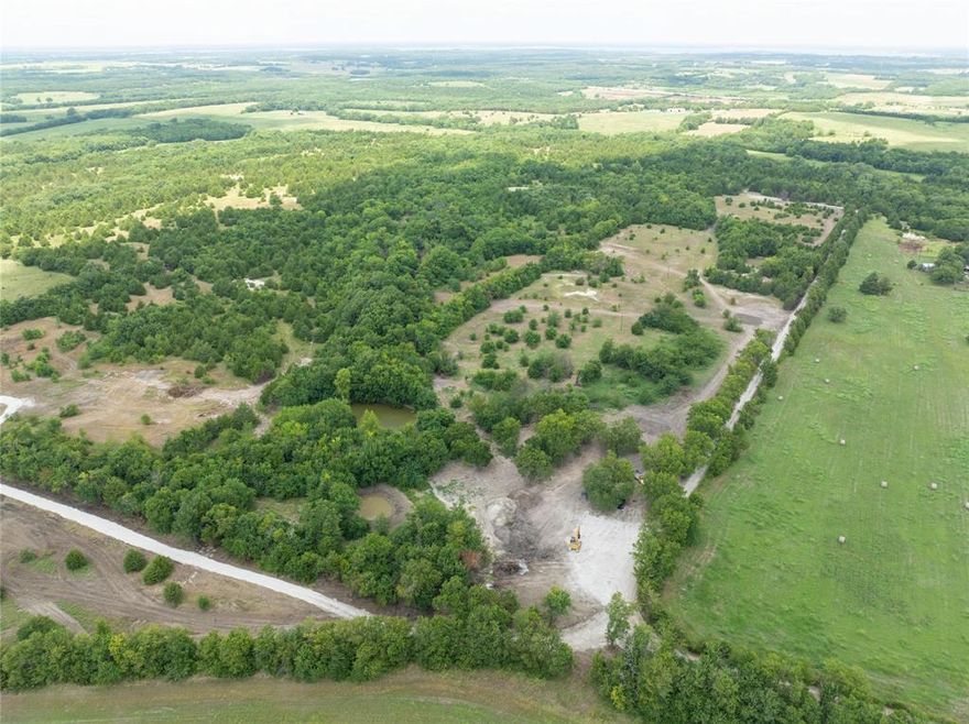 Tract 8 of 8 offers a beautiful 5-acre country retreat located less than five minutes from the historic town of Honey Grove, Texas, providing convenient access to local schools, grocery shopping, and restaurants. This property is just 9 miles from the new Bois d’Arc Lake, making it an excellent location for outdoor recreation and future growth. The land features mature trees that add natural beauty and privacy, creating a peaceful rural setting. Power is available, and a water line upgrade is currently in progress, adding to the property’s appeal and readiness for development. This tract is an ideal opportunity for those seeking a quiet country lifestyle with nearby town conveniences.