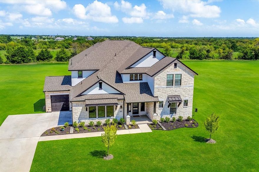Why settle for buider grade finishes when you can own this brand-new, fully upgraded 2024 estate—listed well below appraised value—giving you instant equity from day one?

Set on a pristine 1-acre lot, this 4,781-sq-ft residence showcases nearly $200,000 in premium upgrades already included, saving you over $80,000 compared to building the same home today. Featuring 5 spacious bedrooms, 4.5 bathrooms, a dedicated office, versatile flex room, formal dining, expansive living area, utility room, plus an upstairs game room, loft, and media room—this home offers the perfect blend of everyday comfort and grand entertaining.

The chef’s kitchen shines with quartz countertops, a large center island, stainless steel appliances, gas cooktop, built-in oven, and microwave. Wide-plank floors, designer tile, and elegant recessed lighting elevate every space. Thoughtful tech and wellness upgrades include in-ceiling speakers in the living room, a full media-room speaker system, and a whole-home water filtration system.

The main floor features both the private primary retreat and a guest suite, while upstairs offers three additional bedrooms and generous living spaces. The primary suite pampers with a freestanding soaking tub, oversized glass shower, and dual vanities.

Sliding glass doors open to a tranquil backyard setting, while a 3-car garage, no MUD or PID, and proximity to Celina High School enhance everyday convenience.

Don’t wait 12+ months to build and pay more—this brand-new, move-in-ready estate is available now with upgrades galore, instant equity, and true luxury already built in.