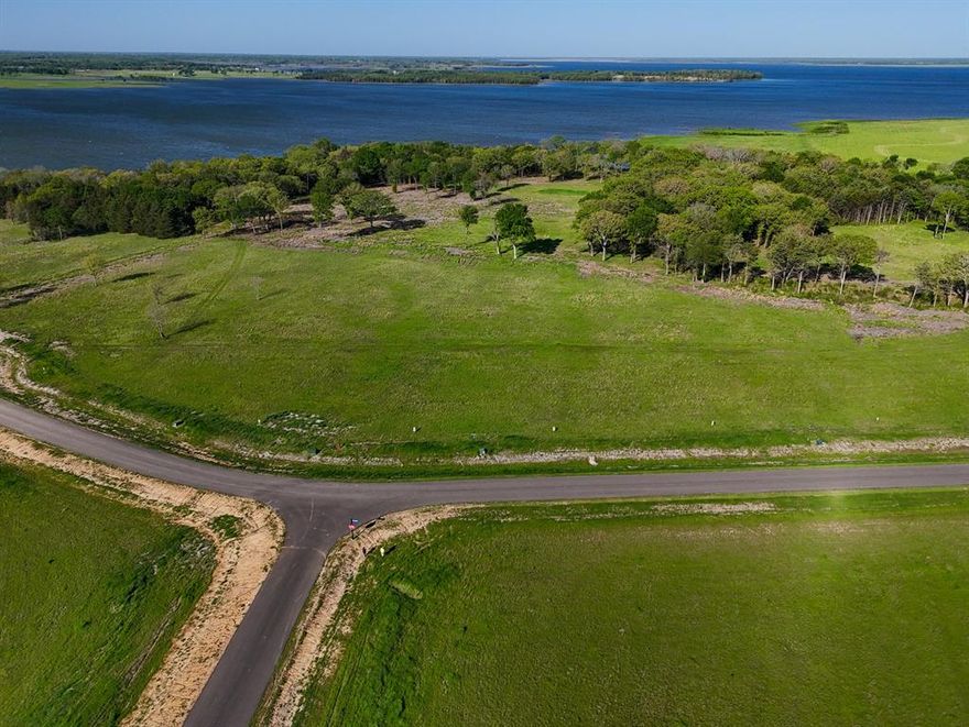 Bois d'Arc Lake Opened to the Public on April 17, 2024 and the Shores at the Peninsula now has paved roads. Build your dream lakefront home at 330 Lakewood Lane in The Shores at Peninsula on the new Bois d'Arc Lake! Take a scenic evening walk down to the lake and enjoy the sunset as you look to the west.  Discover community activites like pickle ball courts, dog walk, and entertaining friends and family at the existing multi-million dollar clubhouse.  There is a putt-putt course and an infinity pool for endless fun and relaxation.  This is a gated community with all the exceptional standards you would come to expect from this nationally recognized developer. The current development rules allow for short term rentals with some light restrictions. Choose your own builder and build on your timeline! The excitement of the new Bois d'Arc Lake is increasing daily! Come see this one of a kind lot today!!