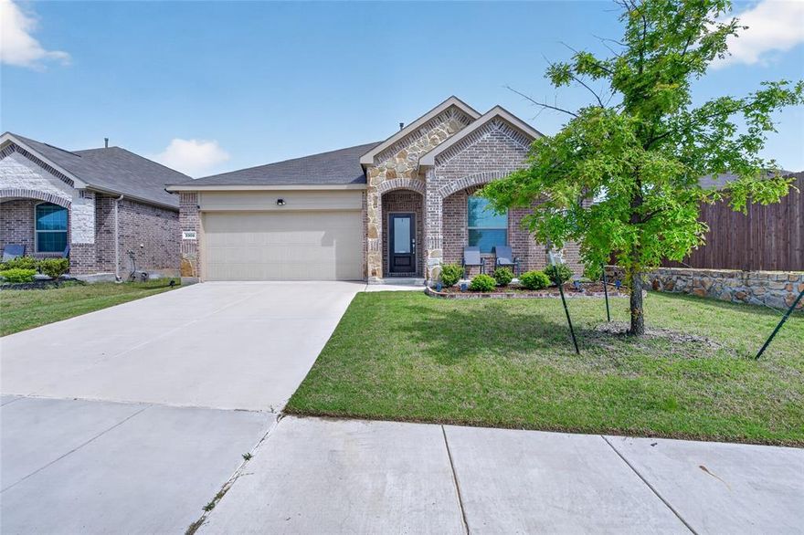 This well-maintained single-story home offers a functional layout with a clean, updated exterior and strong curb appeal. The front of the home features a blend of brick and stone with a covered entry, while the attached 2-car garage provides convenient parking and additional storage.

Inside, the home features two living areas, including a family room open to the kitchen, creating a natural space for everyday living and entertaining. The kitchen boasts an island and breakfast bar, perfect for casual meals or gathering with family and friends. The layout allows for easy flow between the living, dining, and kitchen spaces, while maintaining separation between the primary suite with ensuite bath featuring dual vanity and shower and the secondary bedrooms for added privacy.

The outdoor space is a standout feature, offering a spacious, fully fenced backyard with plenty of room for entertaining, pets, or future additions. A covered rear patio extends the living space outdoors. Additional practical features include a dedicated laundry room with built-in shelving for storage and organization.

The lot offers a balanced footprint with comfortable spacing from neighboring homes, making this property a strong option for buyers seeking functionality, multiple living areas, a primary suite retreat, outdoor space, and a well-designed layout. Residents also enjoy access to a community pool, and a stocked pond sits just across the street.