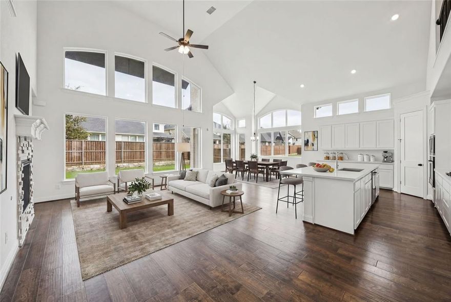Just completed and move-in ready, this gorgeous new Grand Home is located in a family friendly, master-planned community designed for family entertaining. Enjoy resort-style amenities including a swimming pool, playground, catch-and-release fishing pond, & scenic bike trails. This east-facing home features light brick with dark trim and rock edged flower beds. Inside you will find 5 large bedrooms, including a downstairs guest suite that’s perfect for visitors or a nursery. A private home office, plus a formal living with barn door. The stunning vaulted family room boasts a wall of windows and a stone fireplace. Also a large upstairs game room is upstairs along with a media room or children’s retreat ideal for entertaining.
Thoughtfully designed with custom touches throughout, this home features a curved staircase with wrought iron spindles that extend along the upstairs curved walls, 8-foot interior doors, and sleek rocker switches. The open-concept kitchen is outfitted with Omegastone slab countertops, Shaker-style cabinetry, a gas cooktop paired with a stainless vent hood, a full bowl sink, trash drawer, and a large island. The covered back patio has a gas line for a future BBQ.
The primary bath offers a luxurious retreat with a free standing garden tub, separate Marlana vanities topped with rectangular sinks, and a frameless glass tiled shower. The laundry room has a sink. Additional highlights include a security system, sprinkler system, and energy-efficient features such as R-38 insulation and 2x6 wall construction. Built to Energy Star standards, this brand-new home comes complete with full builder warranties for peace of mind.