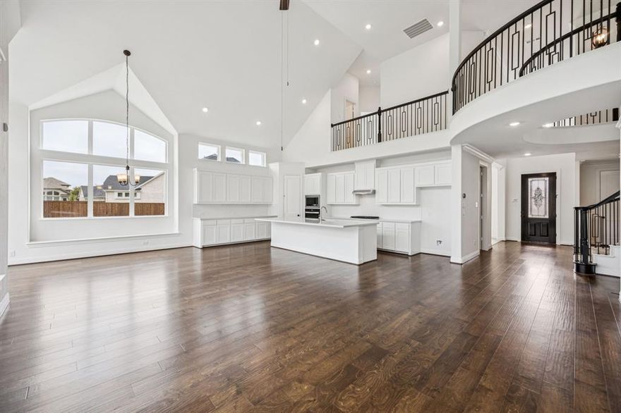 Just completed and move-in ready, this gorgeous new Grand Home is located in a family friendly, master-planned community designed for family entertaining. Enjoy resort-style amenities including a swimming pool, playground, catch-and-release fishing pond, & scenic bike trails. This east-facing home features light brick with dark trim and rock edged flower beds. Inside you will find 5 large bedrooms, including a downstairs guest suite that’s perfect for visitors or a nursery. A private home office, plus a formal living with barn door. The stunning vaulted family room boasts a wall of windows and a stone fireplace. Also a large upstairs game room is upstairs along with a media room or children’s retreat ideal for entertaining.
Thoughtfully designed with custom touches throughout, this home features a curved staircase with wrought iron spindles that extend along the upstairs curved walls, 8-foot interior doors, and sleek rocker switches. The open-concept kitchen is outfitted with Omegastone slab countertops, Shaker-style cabinetry, a gas cooktop paired with a stainless vent hood, a full bowl sink, trash drawer, and a large island. The covered back patio has a gas line for a future BBQ.
The primary bath offers a luxurious retreat with a free standing garden tub, separate Marlana vanities topped with rectangular sinks, and a frameless glass tiled shower. The laundry room has a sink. Additional highlights include a security system, sprinkler system, and energy-efficient features such as R-38 insulation and 2x6 wall construction. Built to Energy Star standards, this brand-new home comes complete with full builder warranties for peace of mind.