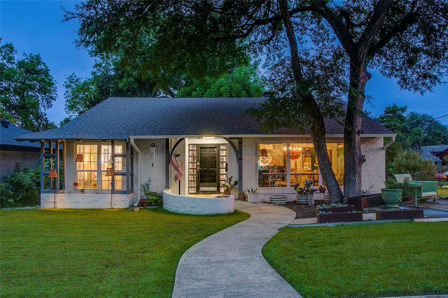 Some homes just have a story, and this one's a good one. Sitting on a corner lot in one of Dallas's best-kept neighborhood secrets, this mid-century home has been genuinely cared for by someone who loved living here. New roof, fresh paint, updated flooring, a brand-new deck; the big stuff is already done. Inside, it lives comfortably and with real personality. The den has a brick fireplace and wood-beamed ceiling that make it the kind of room you actually want to spend time in. The kitchen is set up for someone who cooks; gas range, pot filler, stone counters, farmhouse sink, soft-close cabinets, walk-in pantry with its own exterior door. Both bathrooms have been updated, and tinted framed windows keep the main living spaces feeling bright without the glare. Out back, the xeriscaped yard and large deck are low-key and low-maintenance, perfect for a quiet evening or a laid-back gathering with friends. The neighborhood has its own personality too. Eclectic, welcoming, and yes, there are real peacocks. Once you're here, you'll understand why people don't want to leave.