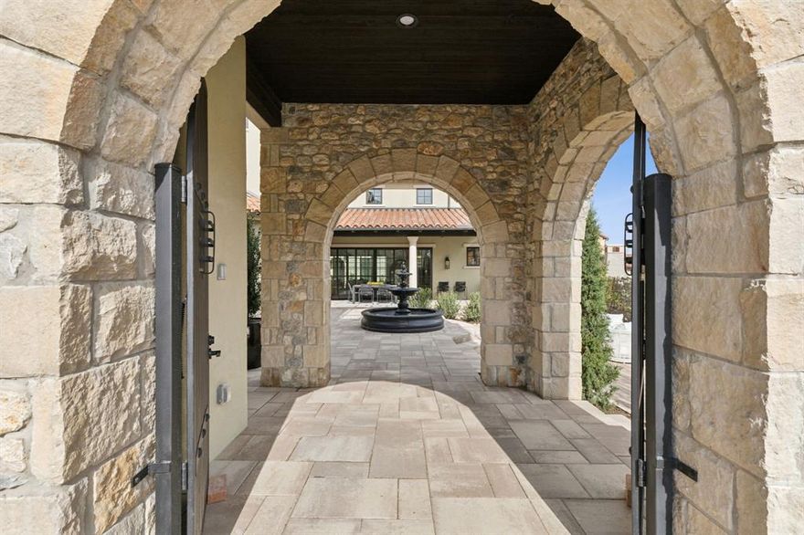 This stunning residence by Crescent Estates showcases a sophisticated design, highlighted by a must-see great room with high vaulted ceilings, wood beams, an elegant spiral staircase, walls of windows, and a connecting veranda that opens to a spacious inner courtyard. This serene outdoor retreat is ideal for gatherings. The home features four spacious bedrooms, five luxurious baths, a dedicated study, and two large living areas. White oak floors, Subzero and Wolf appliances, premium countertops, and elegant lighting complete the home, epitomizing refined living in Westlake. Experience the exceptional lifestyle offered by Entrada's prime location with quick access to top-tier amenities, close proximity to Dallas, Fort Worth, DFW Airport, Westlake's new Lifetime Fitness, Grapevine Lake, and premier shopping at Southlake Town Square, convenience is truly at your doorstep. Entrada is part of Westlake's highly sought-after luxury corridor with Carroll ISD or Westlake Academy school options.