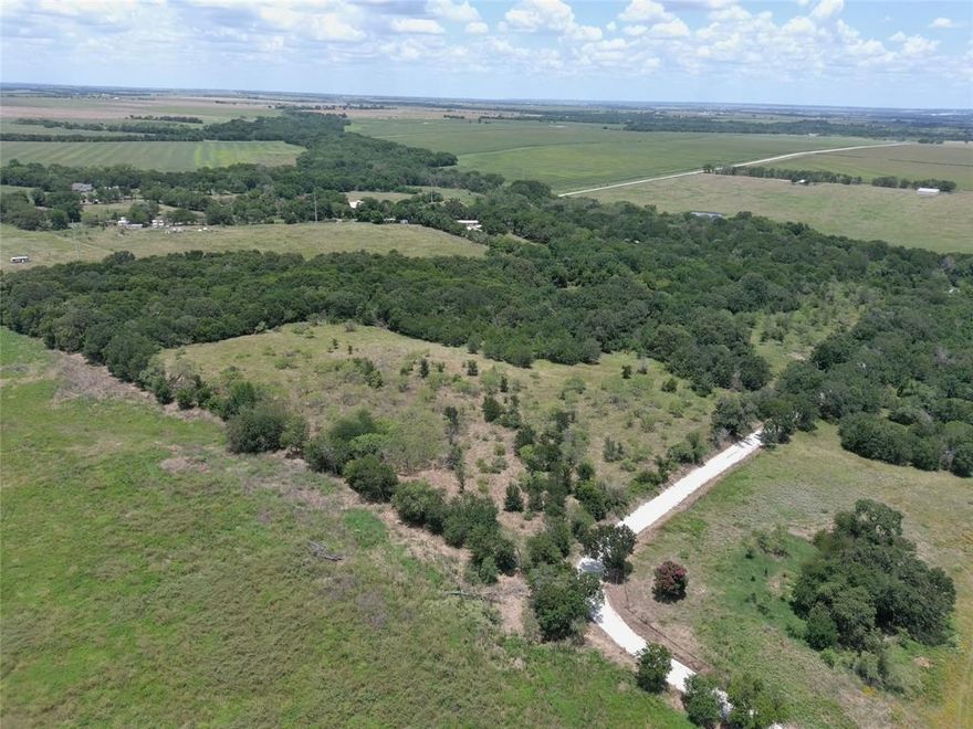 This 20+ acre tract is only a mile off a paved road, FM 1947 - The best of both worlds in that there is pasture area and heavily wooded area - There is 1280 feet of frontage on HCR 2427 and another 448 feet of frontage on HCR 2424. No restrictions make this the ideal place for your country home or sub-dividing and developing it. It is only 10 minutes from Hillsboro and I-35. Great location.