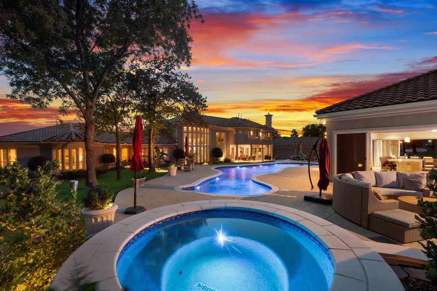 Magnificent Luxury Golf Course Estate with Exceptional Amenities! 
Stunning 4-bedroom, 5-bath sprawling home on a rare corner plus cul-de-sac 2 acre lot in the exclusive 24-7 guarded and gated community -  The Estates at Tour 18. Over 6,300 sq ft of refined living featuring soaring cathedral ceilings, wall of windows, glass stanchion grand staircase and smart home conveniences. Gourmet kitchen, temperature controlled wine room, handsome office, private exercise room, game room with kitchenette and balcony. The luxurious primary suite includes a double sided fireplace and private patio alcove sitting area - a lovely sanctuary for morning coffee. Gorgeous views from every window!

Dream backyard oasis captivates with resort-style meandering pool, spa, fire pit, freestanding chimney, luxury cabana with designer grill station, entertainment bar, ice maker, warming oven, dishwasher, half bath, and fridge - Entertainer's Dream! Spanish tile roof and gated motor court with 5 car garage complete the package. Abundant storage throughout. Minutes from award winning Argyle ISD, Liberty Christian, top shopping, fine dining, healthcare and both DFW & Love Field airports. WOW!