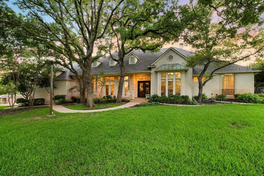 Nestled in the heart of Colleyville, this expansive 2.6-acre property is a true retreat combining luxury, comfort, and privacy. The lot and quality of homes on Bill Simons makes this property truly unique to build your next home or enjoy the one and a half story residence currently built on the pristine land. Step inside to find light hardwood floors and an open-concept layout that offers seamless sightlines throughout the main living spaces. The inviting living room features a striking stone fireplace, custom built-ins, and a wall of windows that frame stunning views of the lush, manicured grounds. The elegant dining room is enhanced by a butler’s pantry complete with a sink and wine fridge, flowing effortlessly into the chef’s kitchen. Outfitted with granite countertops, stainless steel appliances, a commercial-grade gas range, dual sinks, a walk-in pantry, and breakfast bar seating, this kitchen is designed to impress. 
The spacious primary suite is a true sanctuary, offering private patio access and a spa-like bathroom with a jetted tub. Step outside to enjoy the covered patio, perfect for entertaining, overlooking a sparkling diving pool. A detached workshop adds extra functionality to this exceptional property. This is a true gem in Colleyville! The lot is zoned R40. The DFW airport as well as Highways 121, 114, 360, Dallas and Fort Worth are within a quick drive. Shopping and dininig are available in Colleyville, Grapevine, Southlake, just to name a few.