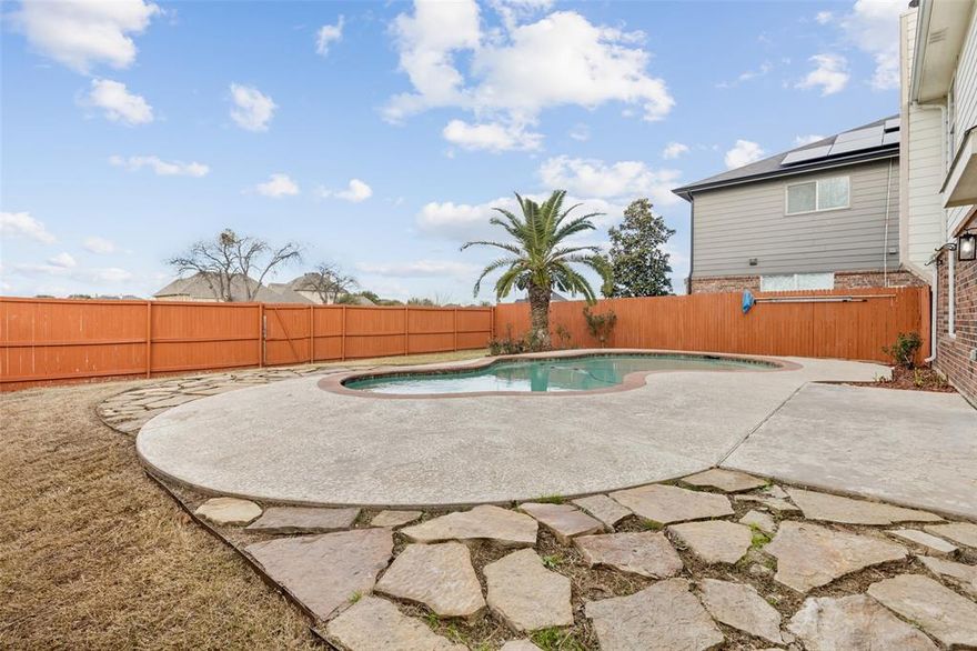 Spacious 2 story home in Haslet featuring a private backyard retreat with in-ground pool and expansive concrete patio, perfect for entertaining, relaxing, and enjoying Texas summers. This bright, open floorplan welcomes you with rich wood-look flooring, a cozy brick fireplace, and abundant natural light throughout the main living areas. The kitchen offers generous cabinet space and a breakfast bar that opens to the living room, making everyday living and hosting effortless. A dedicated dining space near the entry with chandelier lighting provides a warm setting for family meals and special occasions. Upstairs, the oversized primary suite features an ensuite bath with dual sink vanity, soaking tub, and separate shower. Additional bedrooms and flexible spaces allow room for a game room, home office, or guest retreat. One upstairs room includes a built-in workstation, ideal for remote work or creative use. The fully fenced backyard delivers privacy with a beautiful pool, mature palm, and plenty of space for outdoor gatherings. Conveniently located near schools, shopping, dining, and major commuting routes. This home offers the space, comfort, and lifestyle today’s buyers are searching for.