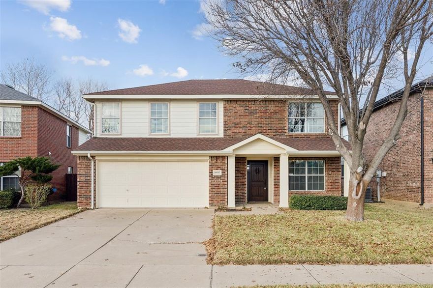 Spacious 2 story home in Haslet featuring a private backyard retreat with in-ground pool and expansive concrete patio, perfect for entertaining, relaxing, and enjoying Texas summers. This bright, open floorplan welcomes you with rich wood-look flooring, a cozy brick fireplace, and abundant natural light throughout the main living areas. The kitchen offers generous cabinet space and a breakfast bar that opens to the living room, making everyday living and hosting effortless. A dedicated dining space near the entry with chandelier lighting provides a warm setting for family meals and special occasions. Upstairs, the oversized primary suite features an ensuite bath with dual sink vanity, soaking tub, and separate shower. Additional bedrooms and flexible spaces allow room for a game room, home office, or guest retreat. One upstairs room includes a built-in workstation, ideal for remote work or creative use. The fully fenced backyard delivers privacy with a beautiful pool, mature palm, and plenty of space for outdoor gatherings. Conveniently located near schools, shopping, dining, and major commuting routes. This home offers the space, comfort, and lifestyle today’s buyers are searching for.