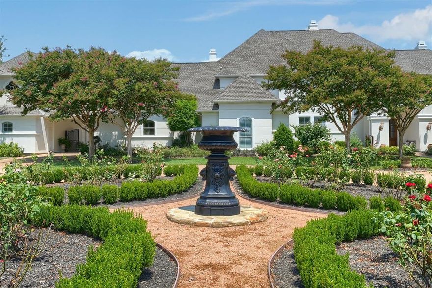 Set on 6.59 breathtaking acres in the coveted Ridge community of Heath, this one-of-a-kind estate offers luxury living with unmatched privacy and lifestyle amenities. With 5 bedrooms and 6 bathrooms, the home was designed to showcase the incredible land it sits on. Floor-to-ceiling windows flood the interior with natural light and frame stunning views of the surrounding landscape.

The backyard is truly spectacular—resort-style saltwater pool, tranquil pond, and brand-new outdoor kitchen surrounded by meticulously curated landscaping that feels like a private arboretum. The setting is so beautiful it could easily host a wedding or unforgettable gatherings under the Texas sky.

A private mother-in-law suite above the garage with kitchenette offers incredible flexibility for guests, extended family, or multigenerational living. It features both interior access to the main home and its own private exterior staircase.

Pet lovers will appreciate the fully fenced property with additional fencing around the pool and outdoor kitchen, plus a thoughtfully designed mudroom with large built-in pet door and dedicated dog wash station.

The seller has invested nearly $400,000 in upgrades since 2020. The property also features a fully irrigated orchard with 60+ fruit trees, an active beehive, and chicken coop, creating a rare blend of luxury living and sustainable country charm.

A truly rare opportunity to own a private retreat just minutes from the conveniences of Heath and Rockwall.