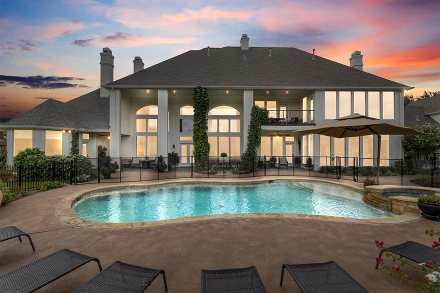 Set on 6.59 breathtaking acres in the coveted Ridge community of Heath, this one-of-a-kind estate offers luxury living with unmatched privacy and lifestyle amenities. With 5 bedrooms and 6 bathrooms, the home was designed to showcase the incredible land it sits on. Floor-to-ceiling windows flood the interior with natural light and frame stunning views of the surrounding landscape.

The backyard is truly spectacular—resort-style saltwater pool, tranquil pond, and brand-new outdoor kitchen surrounded by meticulously curated landscaping that feels like a private arboretum. The setting is so beautiful it could easily host a wedding or unforgettable gatherings under the Texas sky.

A private mother-in-law suite above the garage with kitchenette offers incredible flexibility for guests, extended family, or multigenerational living. It features both interior access to the main home and its own private exterior staircase.

Pet lovers will appreciate the fully fenced property with additional fencing around the pool and outdoor kitchen, plus a thoughtfully designed mudroom with large built-in pet door and dedicated dog wash station.

The seller has invested nearly $400,000 in upgrades since 2020. The property also features a fully irrigated orchard with 60+ fruit trees, an active beehive, and chicken coop, creating a rare blend of luxury living and sustainable country charm.

A truly rare opportunity to own a private retreat just minutes from the conveniences of Heath and Rockwall.