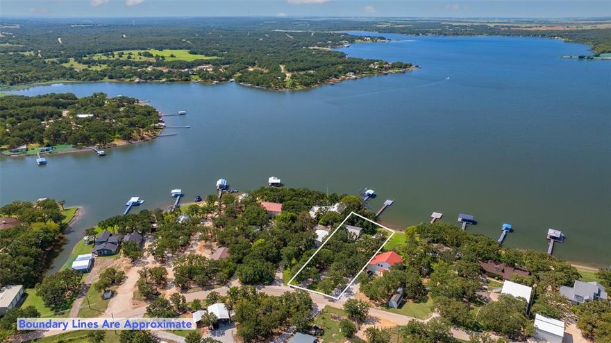 PRIME WATERFRONT LAKE NOCONA PROPERTY ON THE BANKS OF BIG WATER!! Listing back Active due to a buyer's family emergency, no appraisal or inspection had even taken place.  The luxury of lakeside living combined with the beautiful comforts of home blend together effortlessly in this idyllic .48ac setting.  This 1761sf, 2bed, 2bath home boasts a bathroom on both the first and second floor along with an added bonus loft space upstairs.  Spacious rooms with lots of storage, an efficient layout, large windows with never-ending views , and plenty of upgrades characterize this home in its entirety.  Granite counters, stainless appliances, custom cabinets & added built-ins, and decorative lighting are just a few of the highlights.  The primary suite is flanked with TWO, customized walk-in closets and the gorgeous kitchen is equipped with pullout cabinets and appliance drawers.  Custom wine racks are strategically set in the side of the stairwell along with a custom fit dining table that compliments the space seamlessly.  Outside, you will find a floating dock and a paved patio area perfect for admiring the scenic sunsets and enjoying the peacefulness that the waterside ambiance delivers daily.  Added outbuildings include 3 storage sheds plus a well house.  Electric is delivered by Pentex while water and sewer are furnished privately by their own water well and septic system.  This home was completely renovated in 2015 and the metal roof was put on in 2009.  Lake Nocona is located approx 8miles NE of Nocona and is traditionally known for it's exceptional fishing and breathtaking views.  Publicly accessible Nocona Hills Golf Course is just a few minutes away and there are 3 public boat ramps on Lake Nocona for convenient boating access.