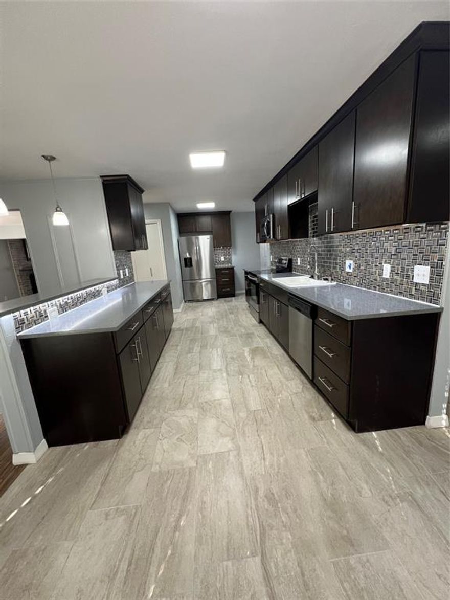 Welcome to 2944 King Cole. Nestled in a quiet, well-established neighborhood, this single-family 2 story home offers a bright open floor plan that connects the living, dining and kitchen areas - ideal for everyday living and entertaining. This freshly painted home features 2 living areas, 3 bedrooms, 2 full baths and 1 half bath. Natural light fills the rooms highlighting the whitewashed fireplace, vaulted ceiling, built in bar open to the dining room. The kitchen with updated cabinets, led changeable lighting, stainless steel appliances and tile floors is the heart of this home with bar counter seating open to the den for easy entertaining. Bedrooms are located on the 2nd floor with updated bathrooms. Close to Cedar Crest Golf Course, Fair Park, Bishop Arts and downtown Dallas.