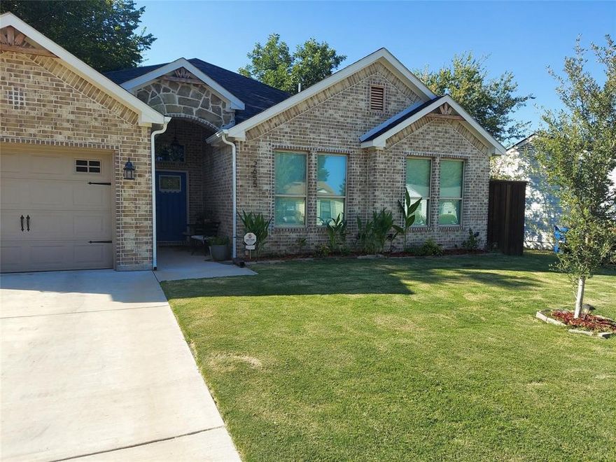 Welcome to Kathleen Ave, your dream home awaits you with Grand Foyer. WIFI Rainbird Sprinkler System. 7' Stained Cedar fence, leaf guard gutters, ceiling fans in all bedrooms. Up lights on the front of the home for added beauty and lights for nightlife. Electric Fireplace in living area, TV frame holder, dimmer switches throughout most of the home for comfort. Blinds throughout the home. Alarm system may convey with the home includes doorbell and two cameras with acceptable offer. This brick home offers modern living with timeless appeal, featuring 4 bed, two full baths, this home is perfect for families, anyone looking for a comfortable stylish space. The open concept layout creates a seamless flow between the living, dining and kitchen areas, perfect for entertaining or relaxing with the loved ones. The kitchen boasts modern appliances, ample counter space with butlers pantry with elegant finishes. The primary suite includes and en-suite bath for added privacy and convenience. The guest bedrooms are cozy yet spacious. Outside, enjoy the low maintenance brick exterior, a spacious backyard, a peaceful neighborhood setting. This home is move-in ready and waiting for you. Covered patios, the front of the home and the back. Extra storage and walk way in the attic. Kitchen has large island with stainless steel sink and pantry. Mud room, utility room, oversized garage. Dual sinks in the primary bedroom with beautiful walk in shower, also has large walk in closet with lots of storage. Decorative chandelier in the entry patio and chandelier in the grand foyer as you enter the home. Luxury vinyl plank floors throughout the home with carpet in the bedrooms. Tile in the kitchen, mud, utility and both bathrooms. Lot's of storage in the kitchen and bathrooms. Can lights in the living, dining, kitchen, primary bedroom, primary bath and over shower and tub. Ask for lender info. Agent in TX. Build Class 16.  80M John Lewis Social Justice Academy middle school brand new near by.