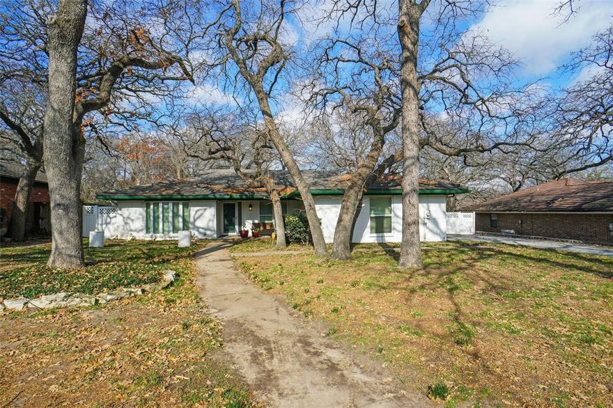 This 2089 square foot home is located in the beautiful Timberlake Estates Addition in Azle, Texas. There is private lake access within the neighborhood and the backyard of the house backs up to a lake slew.  I doubt you will find a house this nice in such a great neighborhood at this price. This is a must see.