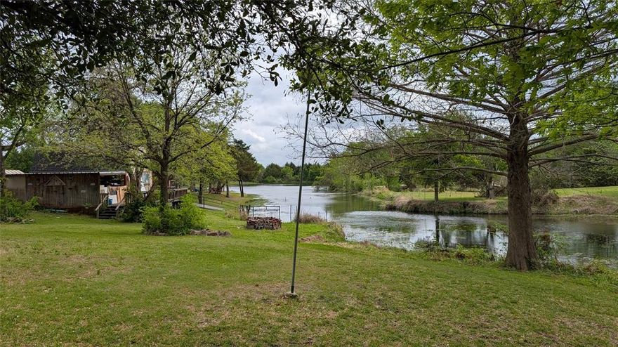 Rare waterfront property on shared pond with acreage. Two master suites with spa-like bathroom in first floor master. Beautiful open concept living and dining area with high ceiling and many windows. Multiple sheds and shops, pump for irrigation from pond. Room for horses or animals. House is efficient with well insulated 2x6 wall construction. Tons of space for parking. Some painting is in progress All fogged and damaged window panes have just been replaced. Property is in Waxahachie ETJ, but not in city limits. Agent is related to Seller. Will consider owner financing. Seller to verify all measurements.