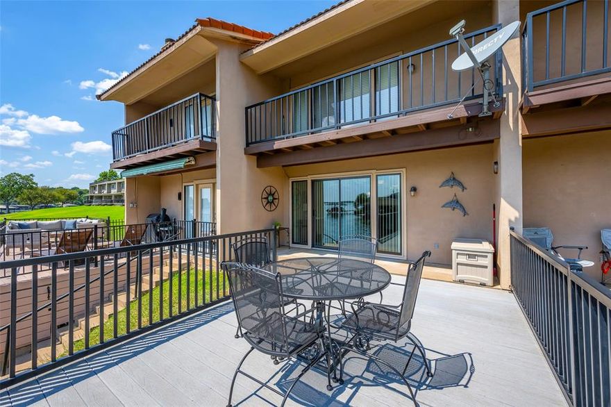 Lake living with a stunning view of Lake Granbury.  This 1200 sq ft townhome with open concept living area, granite countertops, wood burning fireplace, deck over looking the water.  2 bedrooms located upstairs both have full baths.  The community offers many amenities including community pool, clubhouse, unlimited golf, pickleball, tennis courts.  Spacious 2 car garage, deck with underneath storage.