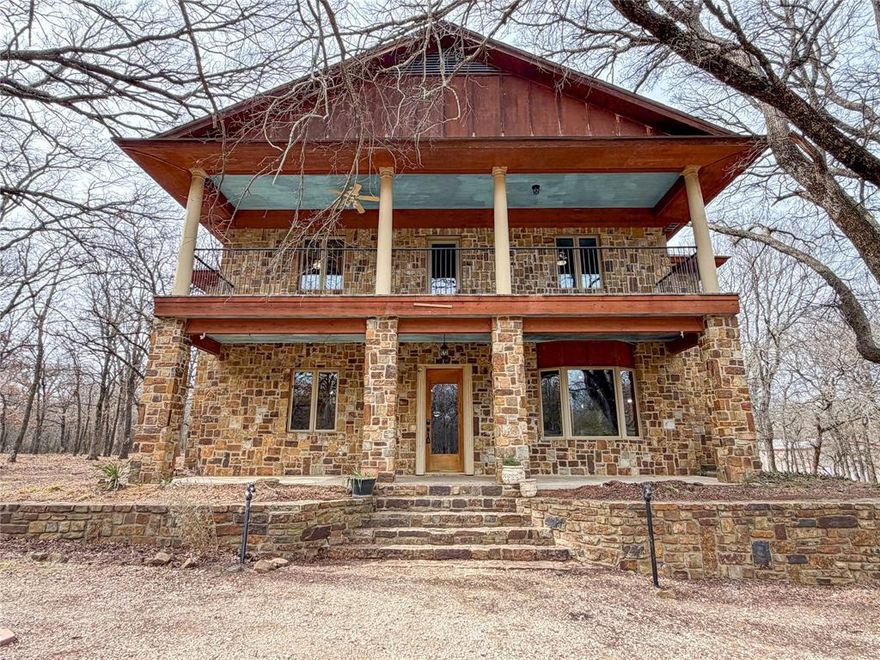 Custom home on 24 acres in highly sought after 7 Wires subdivision in Decatur! This 3700 plus square foot home gives you all the mountain feels, tucked away on its heavily wooded lot. The 2 story home features rock and stone facade, beautiful windows, and a large front porch on the first and second story. Inside the home on the first story, you find large gathering spaces, ornate woodwork throughout to maintain the cabin in the woods feel, generously sized eat in kitchen, double sided, stone fireplace and so much more! Venture up the spiral staircase and you have 3 bedrooms on one side of the home and down the hall to the other side you have the master suite with ensuite bathroom, access to the second story balcony, and a separate office space that is open air to the downstairs. In the office is a second set of stairs that takes you into bonus space! Here you have attic space for storage, and above that a lookout at the very top of the home. The property is nearly 25 acres of heavily wooded area with ample wildlife visiting regularly. The property does also have a 40x50 shop with 2 roll up doors, large enough for projects, collectible cars, or to just be a work shop. Close to the house there is a space to park a camper or RV with access to power at the pole and water nearby.