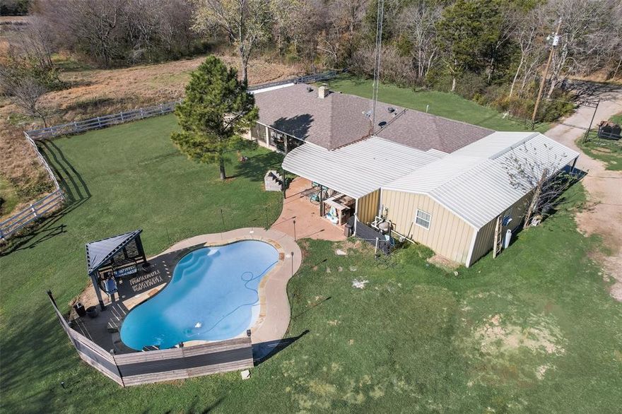 Bring your family and friends for summer time cookouts, pool parties, and fishing.  Enjoy the peace of the countryside while you overlook the beautiful terrain from your back porch.  This well-maintained brick farmhouse on 20 acres is a rare gem. 3 bedrooms, 2 baths, 2 car carport with 20 acres, detached guest house with full kitchen and bath and separate electric utility.  The main house features an open concept with large kitchen, granite countertops, a big island, a breakfast nook and walk-in pantry. Near the new Bois D Ark Lake, sits this beautiful 20-acre tract of land with cross fencing, 2 ponds, an in-ground gunite pool, outdoor kitchen, multiple covered patios, a workshop, barn loafing shed. This house has all that you would need for many years or relaxing and entertainment. This would be a perfect retirement home, vacation rental, or investment. The guest house has its seperate water meter. See listing documents for on site sewer facilities septic tank locations. There is a pad site for RV storage and a septic system. Agriculture exemption in place for hay baling. Hay bales do not convey, but land produces great grass.