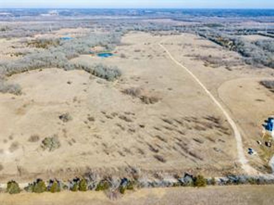 Attention investors!  Lakefront property is located on a hill overlooking the soon to be completed Bois d'Arc Lake. This 157.3 acre tract with rolling terrain has approximately 2700 feet of shoreline and is zoned for 1 acre homesites.  Docks are allowed to be placed on the shoreline per lake regulations.  The boat lane timber cuts are adjacent to the subject property and provide a clear path to all open water.  Depth of the channel is approximately 40 feet.  The balance of the property is a mix of open pasture, large mature hardwoods, 2 ponds and beautiful woods. Easy access to public boat ramps. Water and Electric available. Information is deemed accurate but buyer and buyer agent should verify.