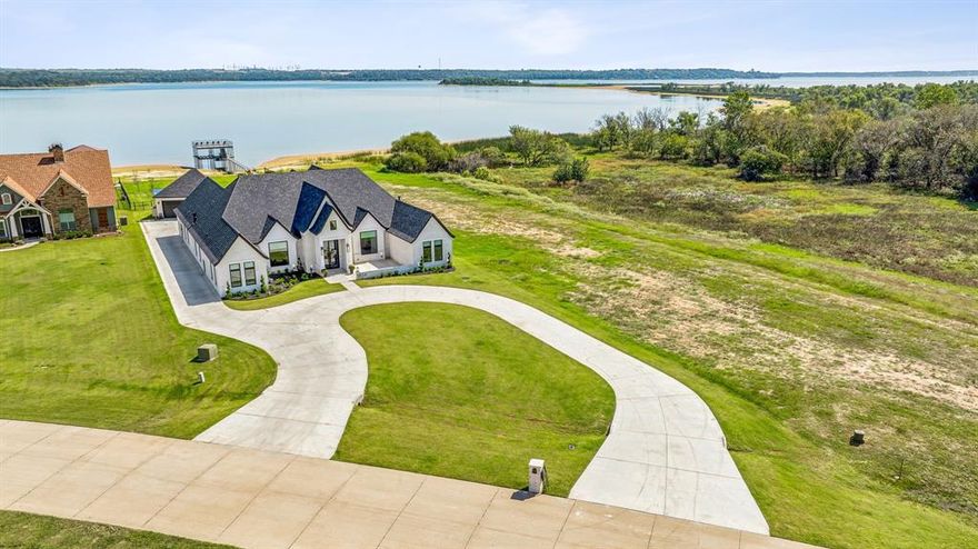 WOW! Brand new lakefront home scores a PERFECT '10' on the Genius, Amenities, Upgrades, Fun, Location Meter. First, 'THE SUN POURS IN LIKE BUTTERSCOTCH AND STICKS TO ALL YOUR SENSES'. Full house generator, 4,800sf, 6 beds 3.5 baths, almost .9ac, smart house, workout room with a lake view like none other, pool so cool with waterfalls, animal washroom in one of the 3 garages, lake views 'BOTH SIDES NOW', an experience of Pelican Island's outdoor beauty & wildlife (unique to any home on EML), pantry with built-ins you never thought you needed, inground trampoline, Pickell ball, basketball court & new dock. You will proclaim this is 'ALL I WANT' & will want to 'STAY AND PUT ON A DAY AND WEAR IT TILL THE NIGHT COMES'. The 'BLUE' water will totally set you free, especially if you are moving from 'CALIFORNIA'. Live the 'CART WHEELS TURN TO CAR WHEELS' years with family in this gated community as you have 'CONVERSATION' & enjoy the 'CIRCLE GAME'.