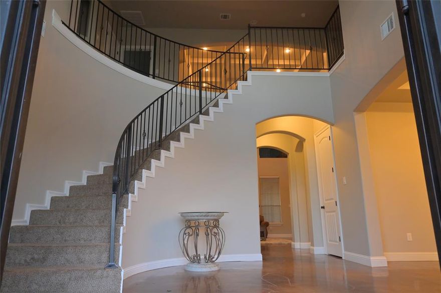 Step into a refined elegance with this exceptional 5,535 sq ft two-story estate, gracefully situated on a 0.5-acre lot in the prestigious Forest Hills Subdivision. Thoughtfully designed for elevated living and privacy, this residence offers six bedrooms, including a remote primary suite on the first floor, four full baths, and a layout that seamlessly blends sophistication with comfort. This home has striking metal double doors. The formal living room boast soaring 30-foot ceilings, creating a dramatic yet inviting space, while the expansive great room is ideal for hosting elegant gatherings or intimate evenings at home. The chef-inspired kitchen is equipped with commercial-grade appliances, including a professional refrigerator and range, double ovens and generous prep and entertaining space perfect for culinary enthusiasts and entertainers alike. Three fireplaces are thoughtfully placed throughout the home adding warmth, ambiance, and timeless charm. Retreat to the spa inspired primary suite featuring an oversized jacuzzi-styled soaking tub and a 360-degree multi-head shower and wet bar. Upstairs, enjoy a dedicated game room and a fully finished theater room, offering an immersive entertainment experience without leaving home. This estate effortlessly combines luxury, privacy, and exceptional craftsmanship, offering a rare opportunity to own  a home that delivers both prestige and lifestyle.