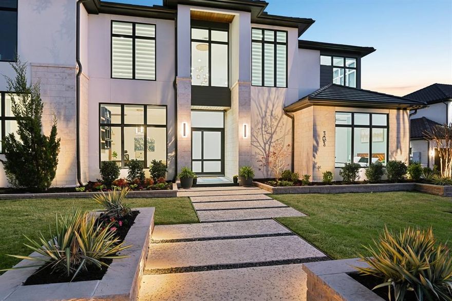 In the gated Crescent Heights community of Southlake and award winning Carroll ISD, this exceptional modern custom estate offers upscale living  minutes from Southlake amenities. Positioned on a .64 acre interior culdesac lot within walking distance to Bicentennial Park and The Marq Southlake. This home captures beautiful Texas sunset views and offers 7,328 square feet of thoughtfully designed living space. A striking stucco and stone exterior with custom iron and glass entry opens to soaring ceilings, custom floors, designer lighting and a dramatic wood & stone fireplace anchoring the main living area. Open concept design blends modern architecture with refined finishes for elevated everyday living. The main level features the luxurious primary suite with spa inspired bath, freestanding tub, dual entry custom shower and separate walk in closets with direct utility room access. Two guest bedrooms, one serving as exercise room, also on 1st floor. Chef’s kitchen includes Wolf appliances, a six burner gas cooktop with commercial vent, Sub Zero refrigeration, custom cabinetry, peninsula island & quartzite waterfall countertops, along with a full secondary catering kitchen, stainless appliances and private entry. First floor also includes a private media room, expansive game room, two dedicated offices with BI cabinetry, and four car garage access. Smart home automation and foam encapsulated insulation enhance comfort and efficiency throughout. Upstairs offers an open family room loft with built in snack bar and sweeping views of the living space below, three spacious ensuite bedrooms including one mini master suite, an additional living area, laundry room & bonus 420sf of unfinished mini primary suite. Resort style backyard features a covered patio, overlooking the pool, spa & fireplace lounge, outdoor kitchen with gas grill and dining area. Southlake living at its finest where timeless style, exceptional craftsmanship and vibrant community lifestyle come together.