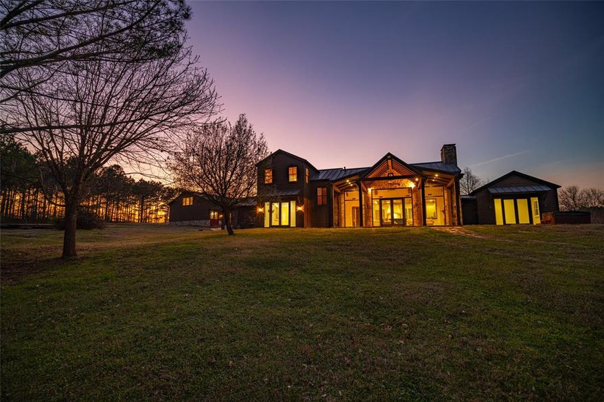 The Cross Pines Lake Retreat is an impressive residential and recreational property located just outside of Mineola, Texas.  The custom improvements feature a large, rustic-style home and a complementary shop with a panoramic view of one of the larger lakes, approximately 40 acres. This property is situated on a 5-acre deeded lot within the massive 2,100+ acre shared ownership property, Cross Pines Ranch. The ranch offers unmatched amenities and a rare opportunity to be a part of this relaxing and exclusive community.

LOCATION
The ranch is located approximately 10 miles northeast of Mineola in central Wood County. Multiple entryways along FM 49 provide easy access to the ranch and homesite. The improvements and lot are located on the western portion of the property.

IMPROVEMENTS
The custom home was constructed in 2009 and includes 4 bedrooms, 4.5 bathrooms, and is positioned to fully enjoy the lakeviews.  The 1st floor features two separate master bedrooms each with back patio access and large en-suite bathrooms.  A centrally located living space and connected master kitchen create a perfect setting for entertaining and enjoying the private lake views.  The large laundry room and half bathroom are located near the front entry with a bonus room or mancave connected to one of the downstairs master bedrooms.  The upstairs contains 2 bedrooms and 2 full bathrooms, perfect for children or guests.  Outside, the expansive back patio overlooks the lake and firepit area.  The adjacent shop resembles the home and includes parking, storage, an upstairs apartment, winch elevator, and capacity for a camper or RV.