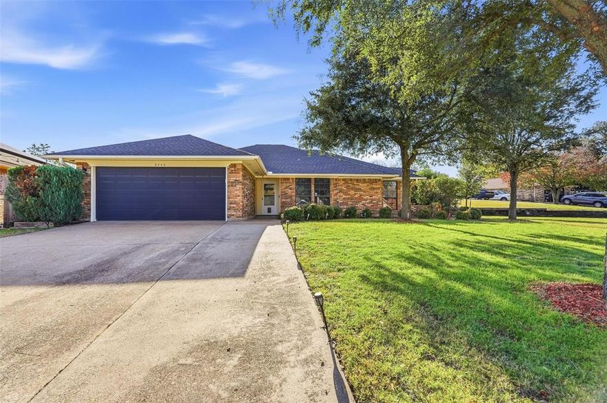 Welcome to this beautifully updated 3-bedroom, 2-bath home set on an impressive oversized corner lot in a quiet, established Fort Worth neighborhood. With incredible curb appeal, mature trees, and a massive open yard, this property offers space and privacy rarely found in the city.

Step inside to an inviting open-concept living area featuring vaulted ceilings, a painted brick fireplace, and rich wood-look flooring. The updated chef-inspired kitchen stands out with bright white cabinetry, quartz counters, stainless steel appliances, and striking teal subway tile backsplash. A breakfast bar connects the kitchen to the living room for easy entertaining.

The primary suite is a true retreat with a spacious bedroom, a warm cedar accent wall, modern double barn doors, and a remodeled bath boasting a large custom tiled shower, updated vanity, and natural wood doors. Two additional bedrooms offer flexibility for guests, office space, or family needs.

Outside, the expansive yard gives you endless possibilities—pool, workshop, garden, playground, or outdoor living expansion. Corner-lot positioning adds privacy and extra parking potential.

Other highlights include a dedicated laundry room, wet bar area, abundant natural light, and a layout that lives large.

Conveniently located near schools, shopping, restaurants.
