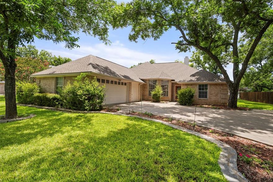 Don’t miss this meticulously maintained, two-owner home in the highly sought-after community of Pecan Plantation! Nestled just minutes from Granbury Lake, this gated community offers an abundance of amenities, including grocery, restaurants, golf courses, pool, marina, dog park, and so much more! This inviting 4-bedroom, 3-bath home features an open floor plan that boasts 10-foot ceilings in the living and dining areas, creating a sense of spaciousness. Designed to accommodate a variety of living arrangements, the home is perfect for multi-generational families, housemates, or anyone who values privacy and comfort. The sequestered primary suite is a peaceful retreat, complete with a sitting area, tray ceilings, and a recently remodeled walk-in shower. The second bed and bath suite offer ample privacy for guests or family members. The third and fourth bedrooms share a full bath. The heart of the home, the kitchen, along with the breakfast area and utility room, is designed with an abundance of storage, ensuring functionality and convenience for everyday living. The oversized garage accommodates two vehicles comfortably, with an additional door specifically for a golf cart. Enjoy peace of mind with a roof replaced in Summer 2023 and an HVAC system updated in Spring 2022.  This home is a rare find in a community that truly has it all. Make it your own and enjoy a lifestyle of comfort, convenience, and endless amenities in Pecan Plantation.
