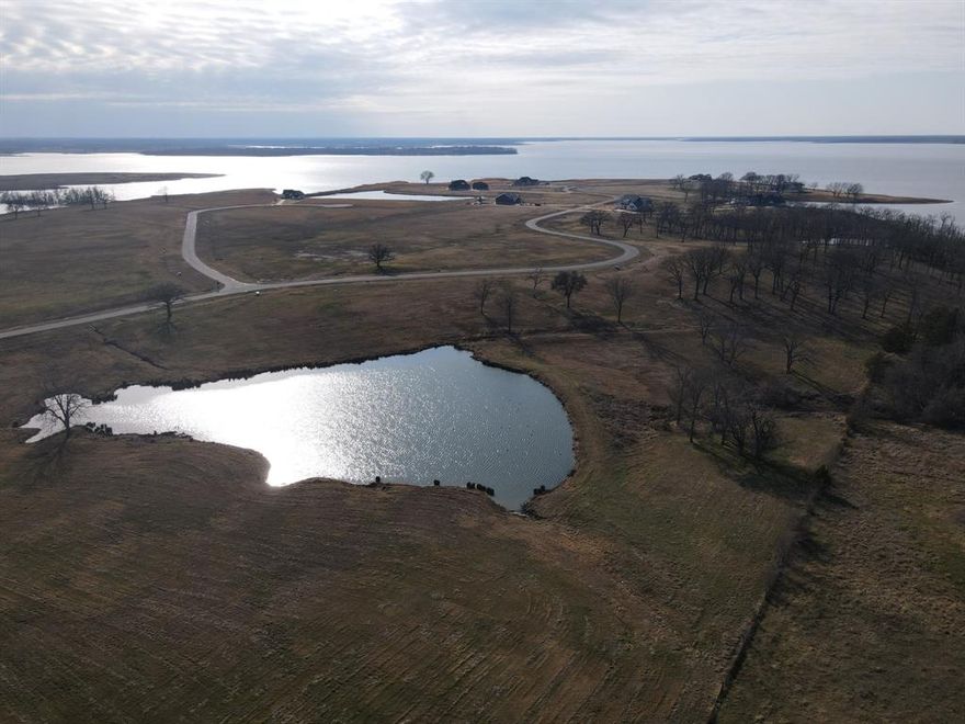 Lake View - 1.82 Acres - Deeded Boat Slip #3 - Private Pond - Under $275K.

Welcome to Lot 3 at 340 Peninsula Drive, a 1.82-acre lake interior homesite with lake views located in the gated community of The Peninsula on Bois d’Arc Lake. This property features open, build-ready space with lake views and a private pond at the rear of the lot shared with two adjacent properties, offering a quiet and distinctive homesite within the community.

The property includes Deeded Boat Slip #3 in the community marina, providing convenient lake access without the maintenance responsibilities of a shoreline lot. This is a bring-your-own-builder community, allowing flexibility for buyers to design a primary residence, second home, or long-term investment. Short-term rentals are permitted, adding to the property’s versatility.

The Peninsula and The Shores at The Peninsula on Bois d’Arc Lake have several completed homes, allowing buyers to tour the neighborhood and experience the community firsthand. Demand has been strong since launch, with early phases selling out quickly.

Residents enjoy access to an impressive list of existing amenities, including a clubhouse with indoor lounge, kitchen, bar, fitness center, observation deck, infinity-edge pool, putt-putt course, and outdoor grilling areas. Phase Two amenities are in progress and include a community marina, paddleboard and kayak launch, tennis and pickleball courts, fenced dog park, multi-purpose field, and playground.

Conveniently located 10–15 minutes from Downtown Honey Grove, approximately 30 minutes to Bonham, under 40 minutes to Paris, under 60 minutes to Sherman and Melissa, and under 90 minutes to the Dallas–Fort Worth metroplex. Located approximately 15–20 minutes from the South FM 1396 boat ramp on Bois d'Arc Lake, this property offers lake access, privacy, and community amenities at an attainable price point.

*Buyer to verify all information*