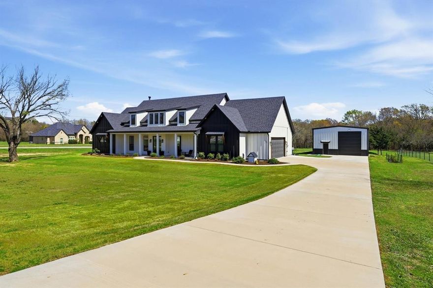 Welcome to the perfect blend of modern farmhouse charm and country space on over 2 beautiful acres within a gated community. This thoughtfully designed home offers a warm, inviting interior with stunning vaulted ceilings and natural light throughout. The gorgeous kitchen features a window overlooking the peaceful backyard and seasonal creek, creating the perfect view while cooking or entertaining. Gas stove, large island and a wet bar off of the kitchen with tons of storage throughout. 

The luxurious primary suite includes an amazing spa-like bath designed for comfort and relaxation. Step outside to enjoy the outdoor kitchen and patio area, with a convenient fenced dog run nearby.

For hobbyists, business owners, or outdoor enthusiasts, the impressive shop is a standout feature with 16 foot walls and an oversized garage door ideal for an RV, boat, or trailer. Inside you will find an 8 x 30 elevated storage space, plus a 25 foot I beam with trolley and electric lift for serious workspace capability. A side door allows for a great cross draft when working inside.

Additional features include a side entry garage and a desirable corner lot location on a quiet cul de sac, offering both privacy and convenience.

This property delivers the best of modern farmhouse living with room to work, play, and enjoy the outdoors.