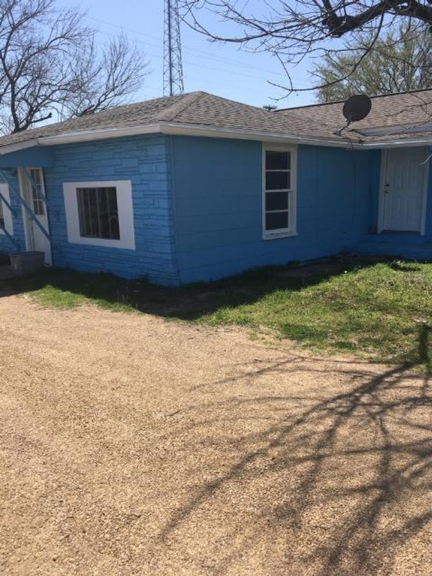 The house is painted blue.  3 Bedroom 1 bath.  Entire home has been painted and updated on the interior.
New septic tank has been installed.  Owner will do owner financing with 59k down and note financed over
10 years.  Great location to either live in or run a business out of because of the exposure to Hwy. 175 traffic.
This price is for the blue home. Home has a new sceptic system.