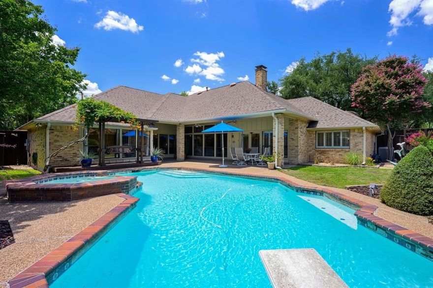 **Exquisite Luxury Living in a Prestigious Dallas Oasis**

Set in a sought-after neighborhood, this magnificent 4-bedroom, 4-bathroom residence perfectly balances elegance and everyday comfort. Designed for luxury living, it offers ample room for sophisticated entertaining and serene relaxation.

Upon entering, you're greeted by a meticulously maintained interior, adorned with custom lighting that accentuates the exquisite crown molding. The kitchen is a culinary haven, featuring a breakfast nook and premium appliances, paired with abundant cabinet storage to meet all your needs. A well-appointed wet bar with a refrigerator ensures seamless entertaining, while the dedicated dining room and separate living and den spaces provide versatility for every occasion. The laundry room has shelves and space with a water line for an extra refrigerator or freezer.

The flooring is a harmonious blend of tile and custom wood, reflecting the home's overall attention to detail. An expansive primary bathroom showcases custom mirrors and an extra-large walk-in closet with built-in shelving, offering both luxury and functionality. Sunlight pours in through the home's large windows, creating a warm and inviting ambiance throughout.

Step outside to discover a meticulously maintained exterior, where a covered back patio with an arbor invites you to unwind, complete with a built-in seat swing. The outdoor space continues to impress with a Gunite diving pool, featuring steps, a bench, and an attached hot tub with an enchanting water feature. Privacy landscaping and a board-on-board privacy fence ensure a secluded retreat for outdoor enjoyment.

Experience an abode where luxury is woven into every detail, promising an unparalleled Dallas living experience that beckons discerning homeowners seeking refined elegance and modern convenience.