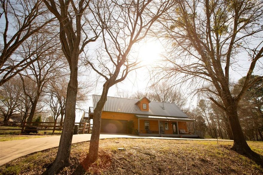 **Seller is offering $5,000 in buyer's concessions**Experience the perfect blend of serenity and versatility in this charming 4-bedroom, 3-bathroom, 2,360 sq. ft. cabin, beautifully situated on a large corner lot with breathtaking water views. Whether you’re seeking a peaceful retreat or an income-producing opportunity, this home offers it all. Step inside to find a warm and inviting space featuring a cozy wood-burning stove and an abundance of natural light. The sunroom provides the perfect spot to relax and take in the stunning surroundings. Upstairs, select rooms feature private balconies, offering a front-row seat to beautiful sunsets over the water. Outside, you’ll find a tranquil sitting area with a fire pit, ideal for gathering with friends and family under the stars. The property also boasts a mother-in-law suite that can easily be converted into a complete lock-off unit, perfect for a rental income-producing apartment or private guest space. Don’t miss this peaceful lakeside retreat—your dream home awaits!
Seller believes sqft is 2360. Buyer to satisfy.