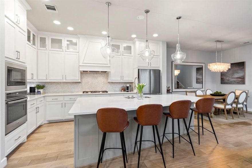 Discover the perfect blend of dramatic style and modern comfort in this stunning East facing, three-story home located in the prestigious Craig Ranch community, which is the largest home in the neighborhood! The inviting 3-bedroom, 3.5-bathroom layout is anchored by a spectacular family room with soaring 20-foot ceilings and a full wall of floor-to-ceiling windows that flood the space with natural light. The open-concept main level flows seamlessly into a gourmet kitchen designed for gathering, featuring a massive center island, sleek countertops, a gas cooktop, and stainless steel appliances. Nearby, the dining room boasts decorative lighting, while a private flex-space offers the perfect setting for a quiet home office. Ascend to the second level to find a versatile living area overlooking the floor below, alongside two large bedrooms and a convenient utility room with built-in cabinetry. The spacious primary suite serves as a true retreat with room for a sitting area, 2 oversized walk-in closets, and an ensuite featuring an oversized shower with a decorative tiled arch. The third floor reveals a massive bonus room with endless possibilities—from a media center to a second private primary suite with its own bathroom. Outside, enjoy the covered patio and a courtyard with maintenance-free turf lighted by cafe lights, is perfect for effortless barbecues. Beyond the front door, you are minutes from the vibrant dining at Hub 121 and District 121. Zoned for highly-rated Allen ISD schools and close to scenic hike-and-bike trails, this home offers an unparalleled North Texas lifestyle. Schedule your private tour today to experience this masterpiece in person!