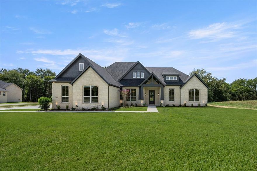 MLS# 20988196 - Built by J Houston Homes - Ready Now! ~ This stunning single-family residence, located in the desirable Waterfall Ranch subdivision, offers 3,093 sq. ft. of thoughtfully designed living space. With four spacious primary bedrooms and three full bathrooms, this home is perfect for families seeking comfort and style. The open floor plan features two inviting living areas, a dining area, and a cozy wood-burning fireplace, creating an ideal setting for gatherings. The kitchen boasts granite counters, a large island, and a pantry, complemented by decorative lighting and vaulted ceilings. Enjoy outdoor living on the covered patio, overlooking a beautifully landscaped yard with ample space for recreation. Additional highlights include a three-car garage, high-speed internet availability, and modern heating and cooling systems. Located within the Waxahachie ISD, this home is set for completion by September 2025. Don’t miss the opportunity to make this your dream home!