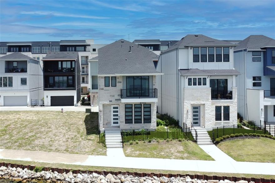 WATERFRONT resort style living on the shores of Lake Ray Hubbard! Perfectly designed for relaxation, entertainment & everyday luxury. Turnkey designer interior, professionally furnished ready for you to live a vacation lifestyle! Stunning residence features an open concept floorplan with expansive windows that flood the space with natural light & provides panoramic lake views!
The gourmet kitchen boasts double ovens, gas cooktop, stainless appliances and an oversized quartz island - ideal for hosting family and friends. Dining area opens to private courtyard perfect for entertaining and  enjoying the sunsets! The spacious primary suite is a true retreat, offering luxurious ensuite bath with dual sinks, large walk in shower and an oversized walk in closet. The secondary bedroom includes its own private balcony overlooking the water - perfect for guests or family members seeking their own peaceful space.  An additional living area with a full bath opens to a covered patio, creating the perfect spot for outdoor enjoyment.  This flexible space can also serves as a 4th bedroom or a private study.  Best of all, the home is fully furnished and move-in ready for you to start enjoying lake life! Walking trails around the lake & within walking distance 
 to Sapphire Bay Marina. Convenient location to major highways, about 19 miles from Dallas. Across the lake from Rockwall Harbor Area with
restaurants, shops and movie theater.