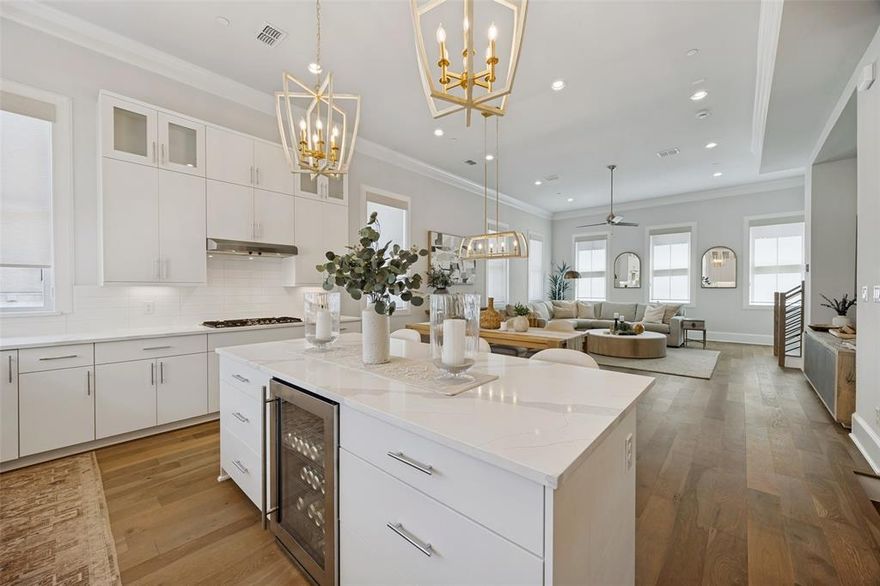 A rare and unique opportunity, one of the last newly built townhomes of its kind and the only one currently available offering this level of flexibility, quality, and design. Immaculate and beautifully maintained, this stunning 2024 built residence invites you to create cherished moments surrounded by natural light and thoughtful finishes.The first floor is a true standout, featuring a highly desirable live work design with a private exterior entrance, allowing clients or guests to enter directly without going through the main home.This space is zoned for commercial use, making it ideal for a professional office, boutique business, or private studio, while also offering the flexibility to serve as an inviting in law suite, guest retreat, or home office with an ensuite bath.As an end corner unit, t offers added privacy along with a charming entry level area perfect for potted plants, creating a warm and welcoming first impression. Experience elevated urban living in the heart of Addison on Restaurant Row, where lifestyle, convenience, and community come together.This beautifully designed 3 story home offers 3 spacious bedrooms & 4 bathrooms,blending modern luxury with everyday ease. Soaring ceilings, 8 foot doors, and oversized Andersen windows fill the home with natural light, creating a bright and inviting atmosphere. The open concept second floor is designed for entertaining and daily living, centered around a gourmet kitchen featuring quartz countertops, double stacked soft close cabinetry, stainless steel Bosch appliances, & a large island perfect for gathering and creating lasting memories. Thoughtful upgrades include designer light fixtures, custom window coverings, enhanced closet systems with built in shelving, and a tankless water heater. The spacious primary suite offers a spa inspired retreat with a soaking tub, walk in shower, and oversized walk in closet. Enjoy the ease of lock and go living with no yard maintenance w nearby dog parks & scenic trails.