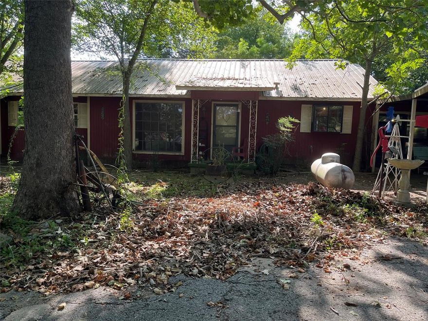 Motivated seller willing to negotiate! Bring all offers! Enjoy the country life on 6.75 acres at an established property located in the lovely Grand Saline. Entry gate adds privacy and security to fenced in property, and back pasture also is separately gated. The home features a side patio and a large main living area. The second living area gives plenty of room for entertaining guest. The classic kitchen includes a glass cooktop. Property features a donkey barn, pole barn, and large workshop. Sale includes mower, brush hog and other equipment located in pole barn. Large workshop is approximately 40x30 and pole barn is 30x20. Buyer to verify all information.