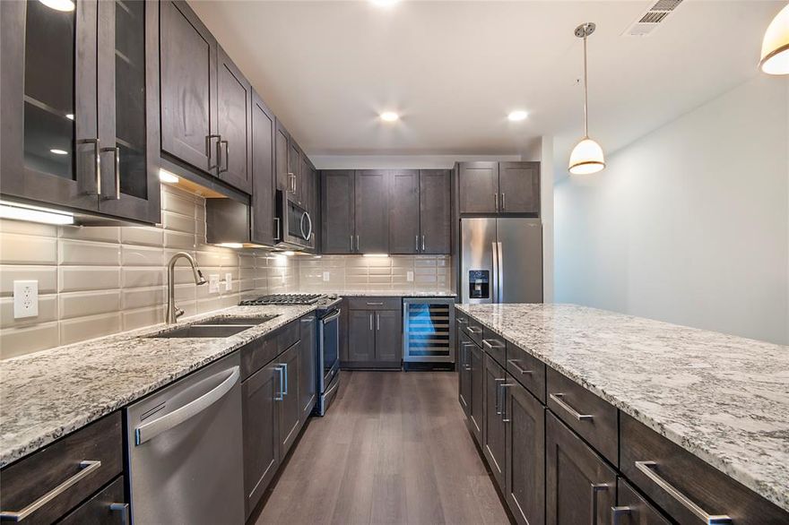 Spacious townhome with fenced yard located in an unbeatable location on Lower Greenville walkable to all of the restaurants, bars and shops. The floor plan features a large open kitchen and living area perfect for entertaining. Also on the second level is a separate dining room featuring a powder bath, closet and balcony. Both sizable bedrooms are on the third level each with en-suite bathrooms and walk-in closets. Other noteworthy features include a turfed yard, wireless speaker system, gas range, wine refrigerator., custom closets, solar shade window covers, washer and dryer, 2 car attached garage and keyless entry. The community amenities are too many to list and include a golf simulator, a fifth floor clubroom with shuffleboard, billiards, a full kitchen and an outdoor deck with fantastic downtown views. There's also a two story fitness center and yoga studio, resort style pool, pet park and grooming station, bus center, resident events & more! Additional $185 month for Amenity Package (includes cable and internet, trash, pest control, etc.) 5% OFF MONTHLY RENT FOR POLICE, FIREFIGHTERS, LICENSED MEDICAL PERSONNEL, AT&T EMPLOYEES, LICENSED EDUCATORS, & RETIRED OR ACTIVE MILITARY. Additional preferred employer list applicants will get their application and administrative fees waived! List price reflects current special of one month free for leases of 12 months or longer. SELF-PRORATED over a 12 month term. Market rent is $4025.  No Gov't Housing Vouchers or airBnB accepted.