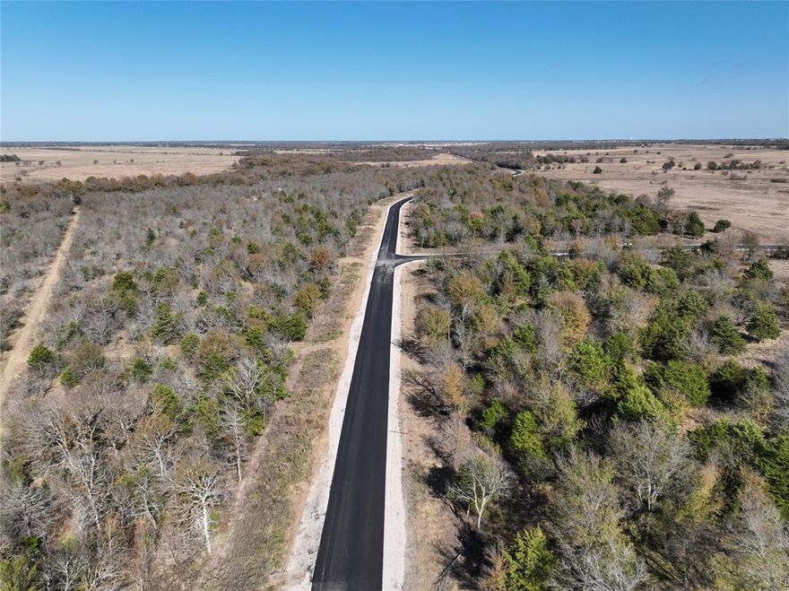 This is it, the piece of Texas paradise you’ve been waiting for. Enjoy 6 peaceful acres with the perfect balance of privacy and convenience, just outside the DFW area. Located only 15–20 minutes from Lake Tawakoni and approximately 6 minutes from local shops, as well as nearby police and fire stations, this property offers both tranquility and accessibility. The lot backs to a large, serene creek, ideal for fishing, relaxing, or simply enjoying the surrounding natural beauty. Paved asphalt roads, a gated entrance, underground electric, water service, and AT&T fiber optic availability make this property ready for your vision. Whether you’re planning to build your dream home or hold as a long-term investment, this land delivers exceptional flexibility. The property is Ag Exempt, keeping taxes low, and there are no restrictions on animals, building materials, or timeline to build. Only a limited number of tracts remain in this close-out phase, don’t miss your chance to own a truly special piece of land.