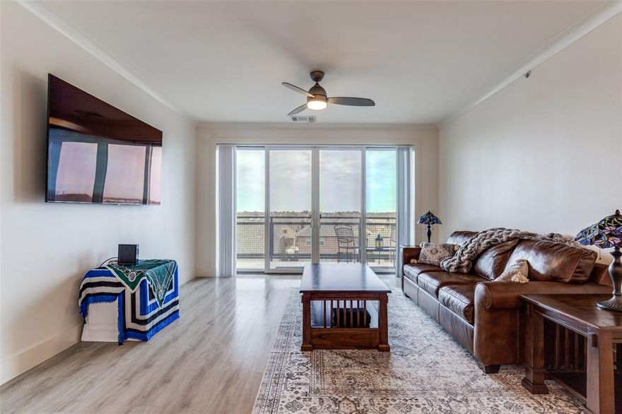 Welcome to 3517 Windhaven Parkway #1307, a beautifully maintained 925 square foot one-bedroom, one-bath condominium located on the third floor of the highly desirable Sojourn at The Realm in The Colony, Texas. This light-filled residence offers an exceptional blend of comfort, style, and convenience, featuring excellent natural light throughout and an elevated balcony view that creates a warm and inviting atmosphere. The thoughtfully designed open-concept floor plan seamlessly connects the living, dining, and kitchen areas, making the space feel expansive and ideal for both everyday living and entertaining. The interior showcases contemporary finishes, updated window treatments, and enhanced closet storage that maximize functionality while maintaining a clean, modern aesthetic. The kitchen flows effortlessly into the main living area and is complemented by included appliances, as the washer, dryer, and refrigerator will convey with the sale, offering true move-in-ready convenience. Residents enjoy the security and ease of a controlled-access building with elevator service, and this unit includes one deeded garage parking space assigned exclusively to the property. Sojourn at The Realm is known for its upscale, walkable live-work-play lifestyle, placing you just steps from dining, retail, grocery, and entertainment options, with quick access to Highway 121, Grandscape, Legacy West, The Shops at Legacy, major employers, and nearby medical facilities. Combining luxury, low-maintenance living, and an unbeatable location, this residence presents an outstanding opportunity to own in one of North Texas’ most vibrant mixed-use communities.