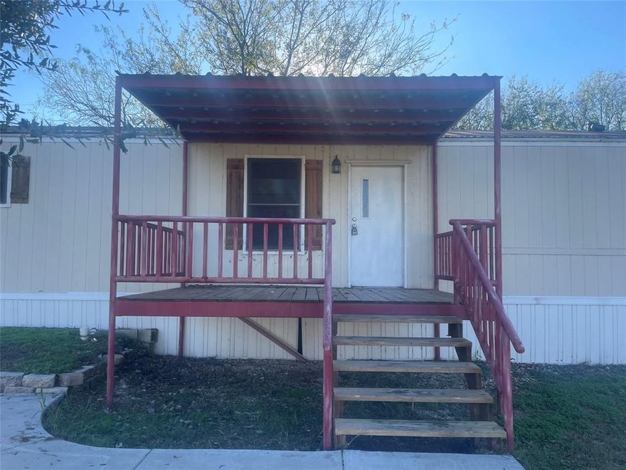 Perfect starter home, rental investment or secondary vacation manufactured home just blocks from Lake Granbury! Take advantage of the area while properties are still priced accessibly. Granbury is experiencing rapid growth with strong schools and has been voted USA Today's Best Historic Small Town multiple times. This home offers a split bedroom layout with 3 bedrooms and 2 full baths. Kitchen comes with electric range, refrigerator and dishwasher. Plenty of storage space in the kitchen with a separate dedicated area for the laundry room. Primary bedroom has a relaxing tub with a separate shower. Home sits on a double lot fully fenced with both front and back deck areas. Plenty of parking with a covered car port at the main entrance gate. Lot perfect for pets and summer parties!

Home is also available for lease. Please contact agent for details.

***All information provided is deemed reliable but, is not guaranteed. All information should be verified by buyers and buyer's agent.***