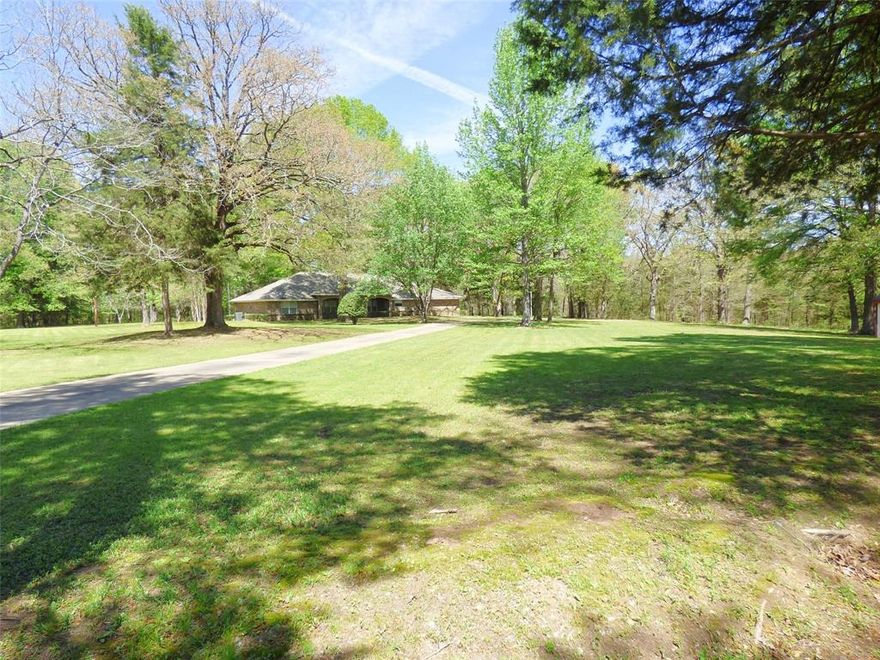 A rare find with this well maintained home, nestled amongst 27 wooded acres! The home has 3 bedrooms 3 baths approximately 2,876 sq ft, large living-dining area, and den with fireplace. All bedrooms are nicely sized. The large utility room has its own bath with adjoining mud room, both rooms together could be used for a mother-in-law suite. Enjoy the views of nature at its best on the 36 X 8 front porch or the 36 X 9 covered back patio. House also has Generac generator so you'll never lose power. The 1,500 sq ft workshop is insulated with 4 overhead doors, great place to work on your hobbies. Call and set up your private showing.