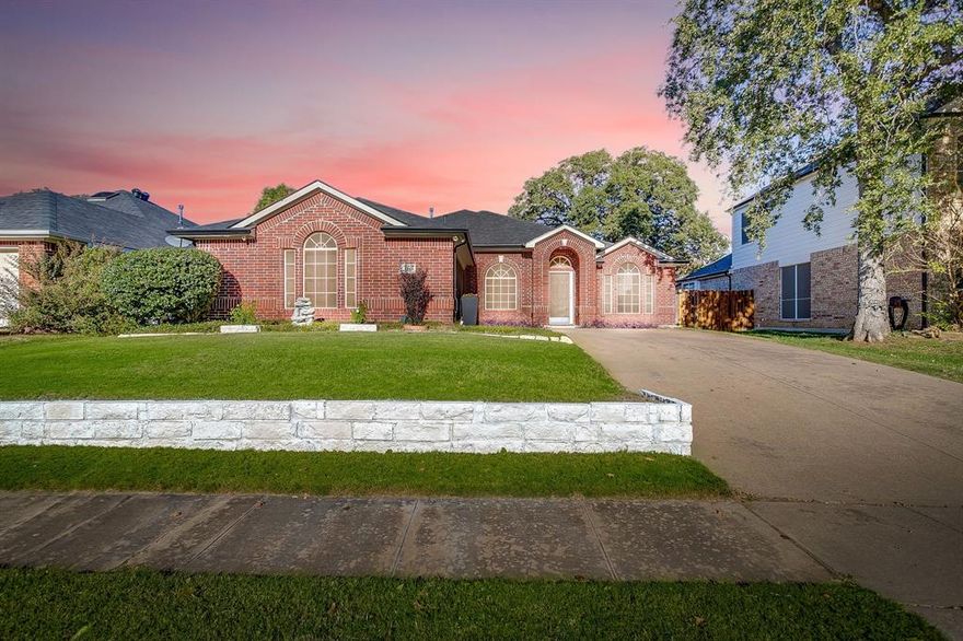 This beautifully maintained home in the highly desirable Joshua ISD offers the perfect blend of comfort, space, and functionality—all on one level. Featuring 3 bedrooms plus an office (or 4th bedroom), 2 baths, and 2 spacious living areas, this layout is ideal for both family living and entertaining. The entry opens to a formal living and dining area, leading into a cozy family room with a gas fireplace and gorgeous wood floors. The open-concept kitchen boasts granite countertops, a breakfast bar, abundant cabinetry, and travertine tile flooring—perfect for gatherings of any size. The primary suite offers vaulted ceilings, dual vanities, a relaxing garden tub, a separate shower, and a comfortable sitting area. Additional highlights include an oversized 2-car garage, a newer back door, and a small storage building for added convenience. Enjoy a peaceful neighborhood with wonderful community amenities, including a swimming pool, golf course, jogging and bike paths, and a playground. This move-in-ready home combines space, style, and comfort in one inviting package!