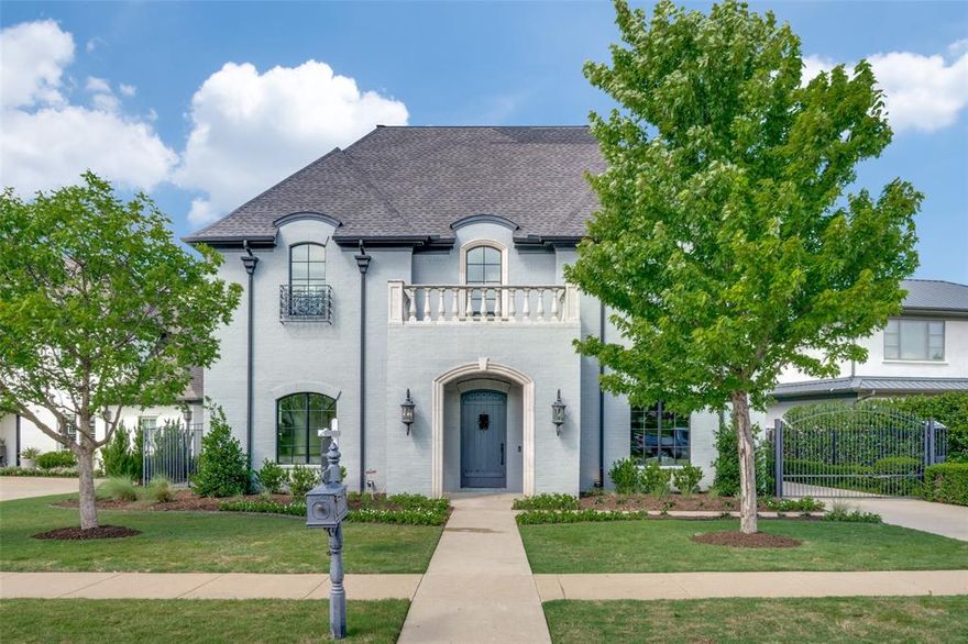 Situated in the heart of Fort Worth’s prestigious Edwards Ranch Riverhills neighborhood near TCU, this stunning French-style estate blends timeless elegance with modern luxury, offering an unparalleled living experience. A grand entrance welcomes you with an impressive statement staircase, setting the stage for the exquisite details found throughout the home. Boasting five generously sized bedrooms and multiple living areas, this home is designed to accommodate both intimate gatherings and large-scale entertaining. The open-concept chef’s kitchen is a culinary masterpiece, featuring high-end appliances, custom cabinetry, and an oversized island that flows effortlessly into the main living space, accentuated by soaring vaulted ceilings and expansive windows that bathe the interior in natural light while showcasing breathtaking views of the beautifully turfed backyard. The outdoor living area is a true extension of the home, complete with a built-in kitchen, covered dining space, and plenty of room to relax or entertain. The primary suite offers a serene escape with a spa-inspired bathroom featuring a soaking tub, walk-in shower, dual vanities, and an expansive closet designed for ultimate organization. A private office attached to the primary suite overlooks the backyard and presents a versatile space perfect for a home gym, study, or retreat. Upstairs, guest suites are adorned with impeccable finishes and provide a perfect blend of comfort and privacy, complemented by additional living space and a media room ideal for movie nights or relaxing. Every detail of this home has been thoughtfully designed to create a seamless flow between luxurious indoor spaces and beautifully appointed outdoor areas. Nestled across from a scenic park and walking trails, this home offers a rare combination of elegance, convenience, and tranquility in one of Fort Worth’s most coveted neighborhoods.