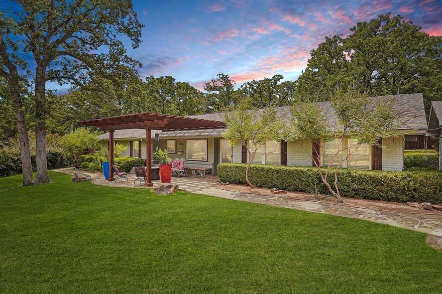 Welcome home to wide-open skies and four beautiful acres of peaceful country living. Take in breathtaking pastoral views and a charming seasonal pond that sets the scene for quiet mornings and golden Texas sunsets. Inside, the open floor plan was made for gathering with family and friends, featuring a warm and welcoming living area accented by rustic wood beams. The kitchen truly shines with granite countertops, generous cabinet and counter space, and a built-in wine cooler—perfect for hosting Sunday suppers or holiday celebrations. A second primary suite with a full ensuite bath offers comfort and privacy, ideal for guests or multigenerational living. Step outside and you’ll find a property that’s as functional as it is beautiful, complete with a powered storage building, greenhouse, and a 20x40 detached garage. An electric gate with two entrances provides both convenience and security, while a brand-new HVAC system and water heater (2024) and a Benjamin Franklin–maintained water filtration system add modern peace of mind. Unwind on the spacious covered flagstone patios or slip into the swim spa and let the day drift away. Blending thoughtful updates with timeless country charm, this special property is ready to welcome you home.