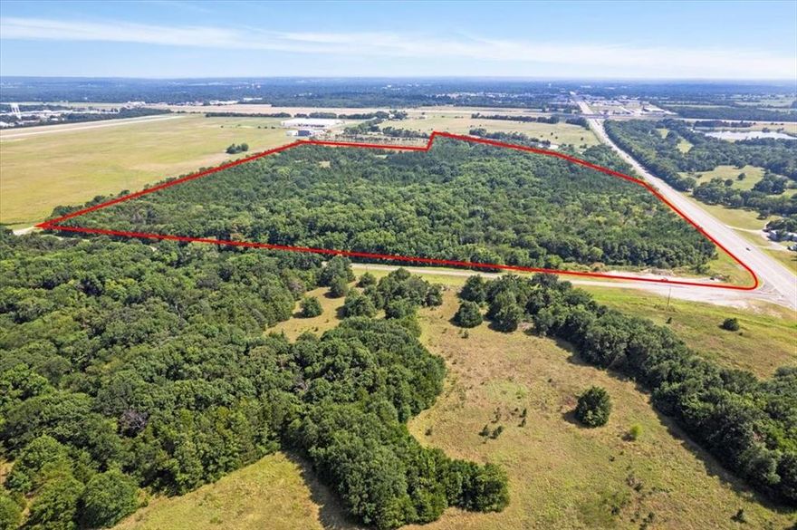 Opportunity is knocking.  Approximately 52 acres of solid potential in the bustling City of Bonham, Texas.  This property is adjacent to Jones Field Airport and has road frontage on all four sides which includes Hwy 121, Airport Road ,FM 898) Corsair Lane, and FC 1565.  The access, amount of road frontage and development potential allows for a variety of uses including residential, commercial, industrial, or airport related such as private hangars, shipping, transportation, etc.  The new lake, Bois d' Arc Lake and the new lake under construction, Lake Ralph Hall has Fannin County in high demand and growing.  Bonham is 27 miles to Sherman, 33 miles to Paris, 10 miles to Texas,Oklahoma Stateline, and approximately one hour from the DFW Metroplex.  The possibilities are endless.